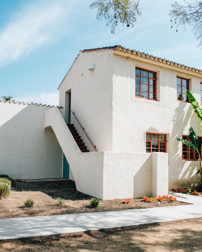 services-02 Spanish-style exterior with stucco walls and lush garden in Camarillo, California.